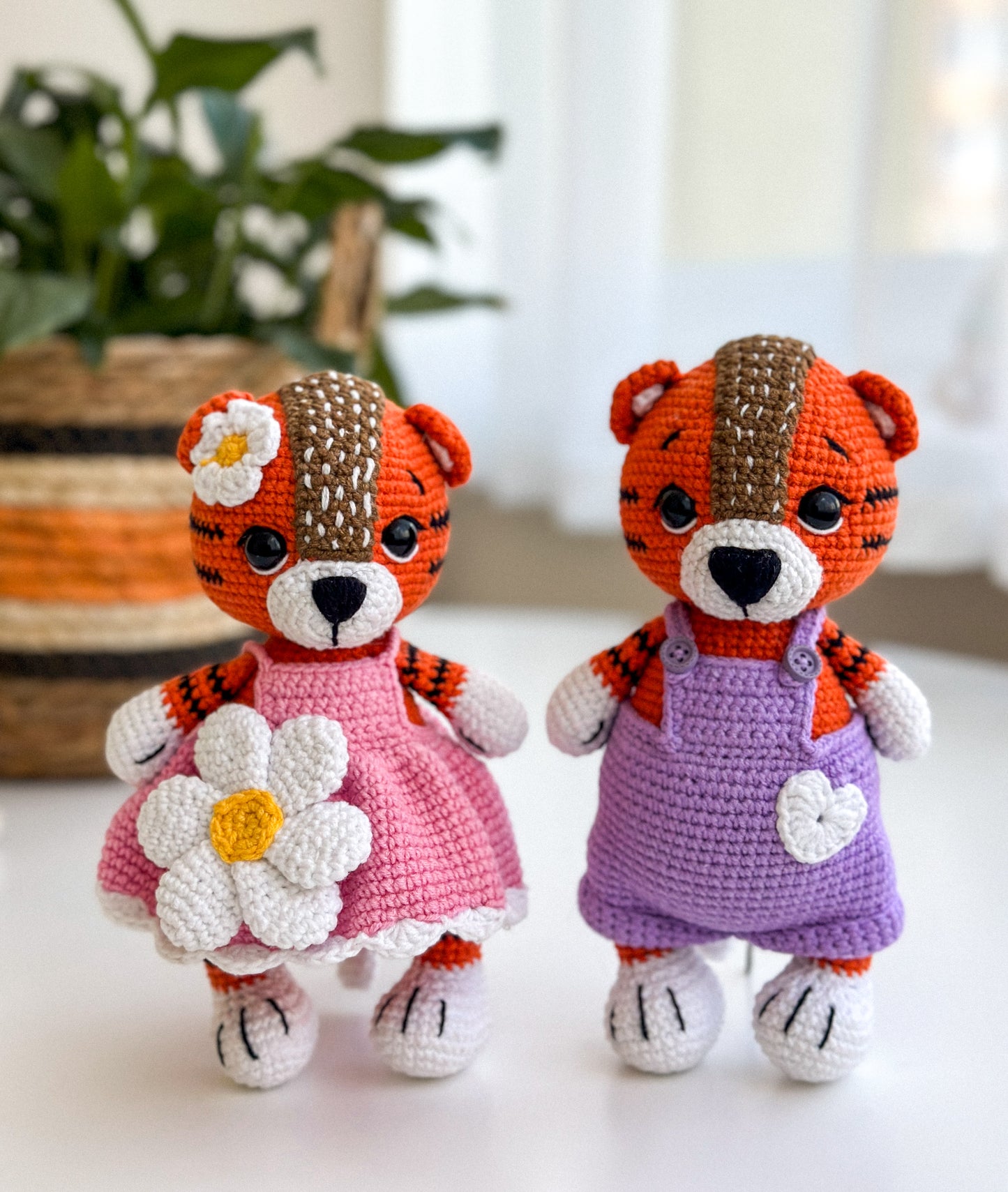 Set of handmade crochet tiger dolls – girl in pink dress and boy in overalls, amigurumi baby toys with cotton yarn