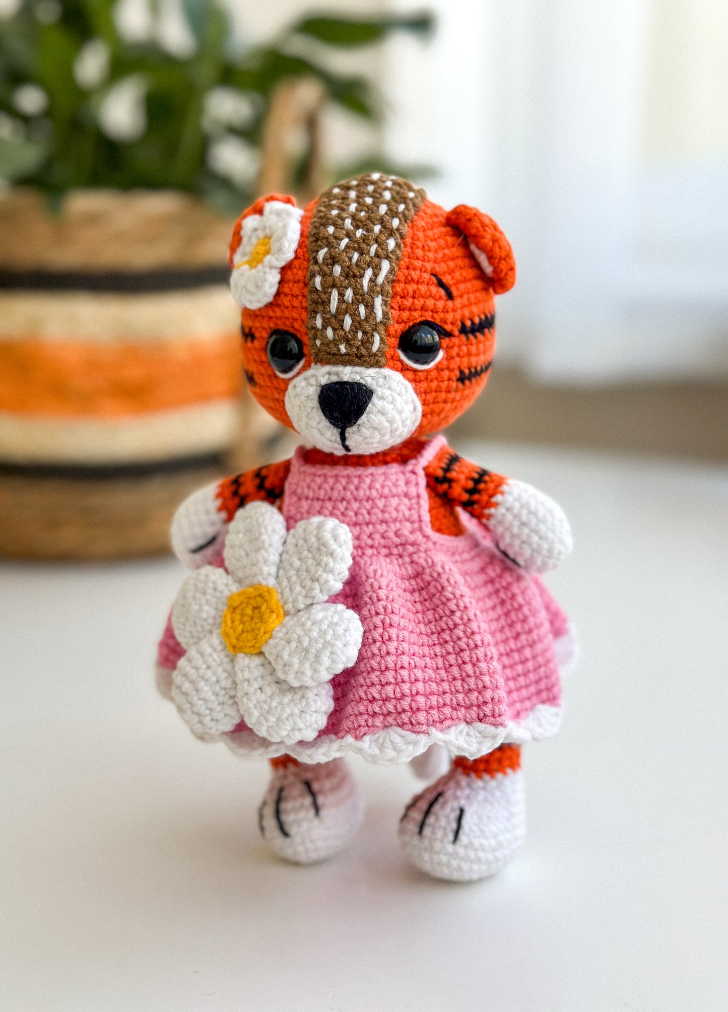 Handmade crochet tiger girl in a pink dress – soft amigurumi baby toy with hypoallergenic filling