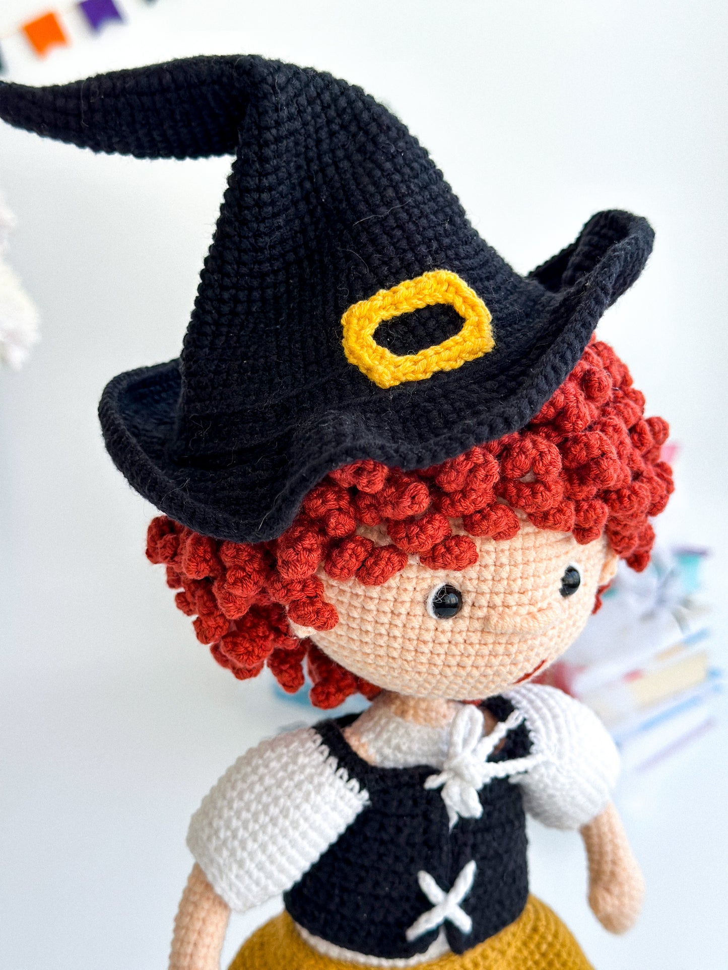 Handmade crochet witch girl with curly hair, black cat, and cauldron – soft amigurumi Halloween doll, 31×14 cm