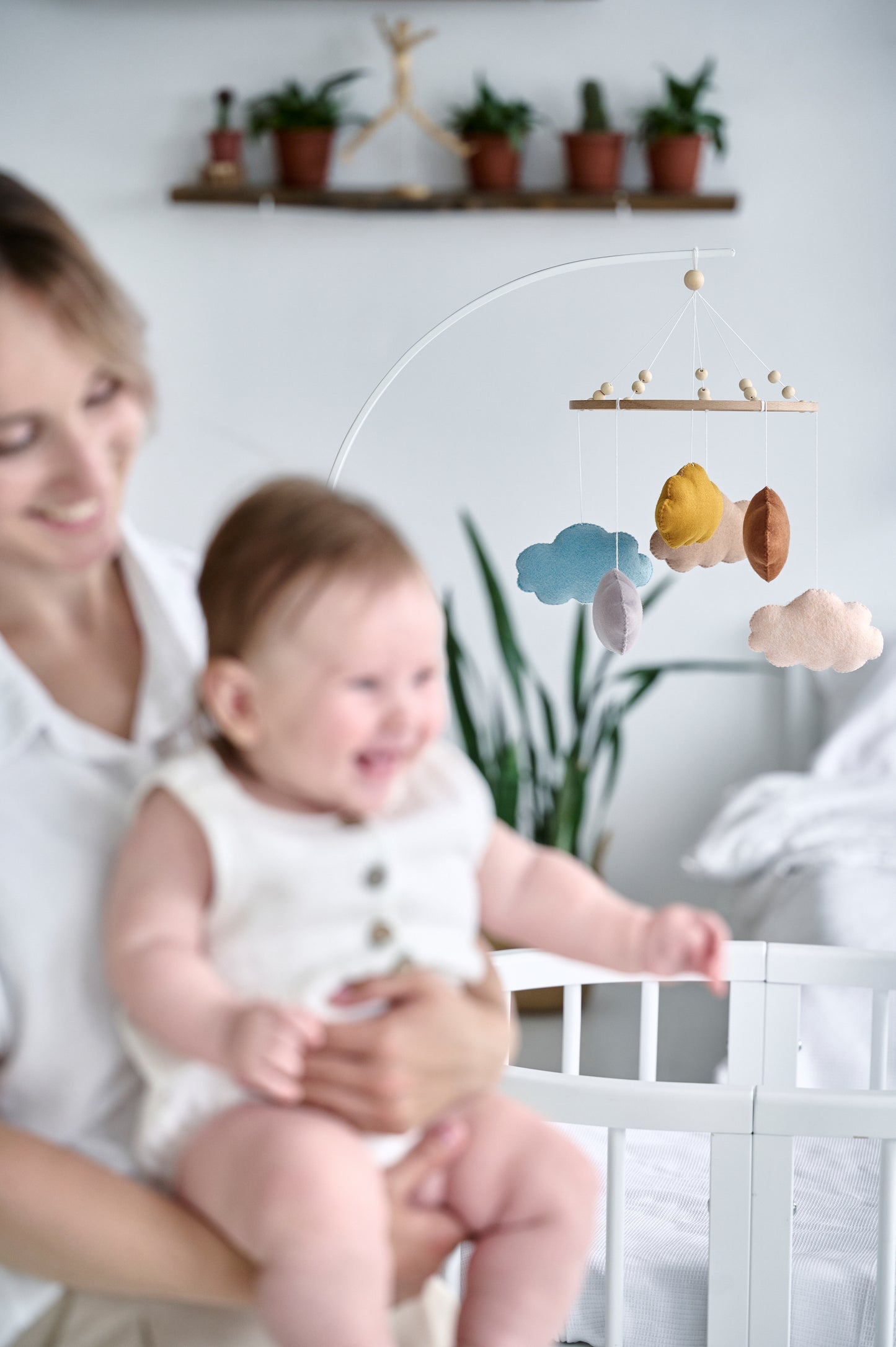 Nursery mobile with six pastel felt clouds – baby shower gift idea