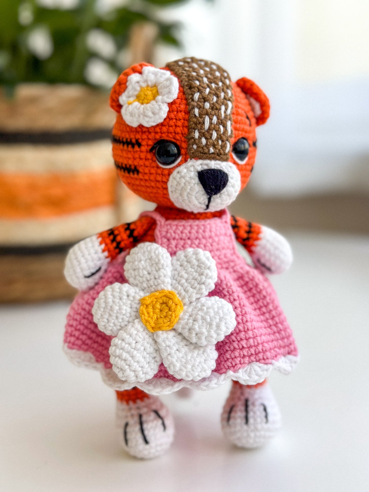 Handmade crochet tiger girl in a pink dress – soft amigurumi baby toy with hypoallergenic filling