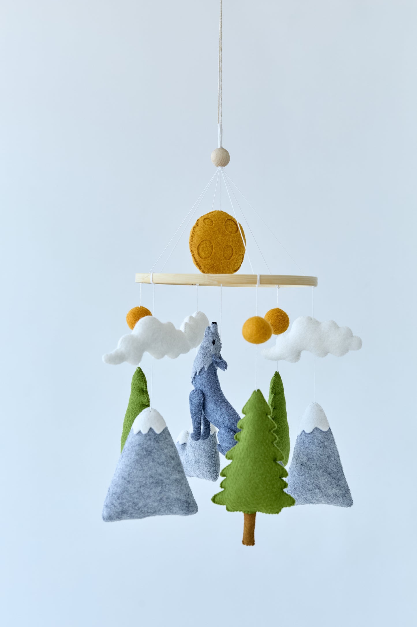Neutral woodland mobile with clouds, moon and wolf