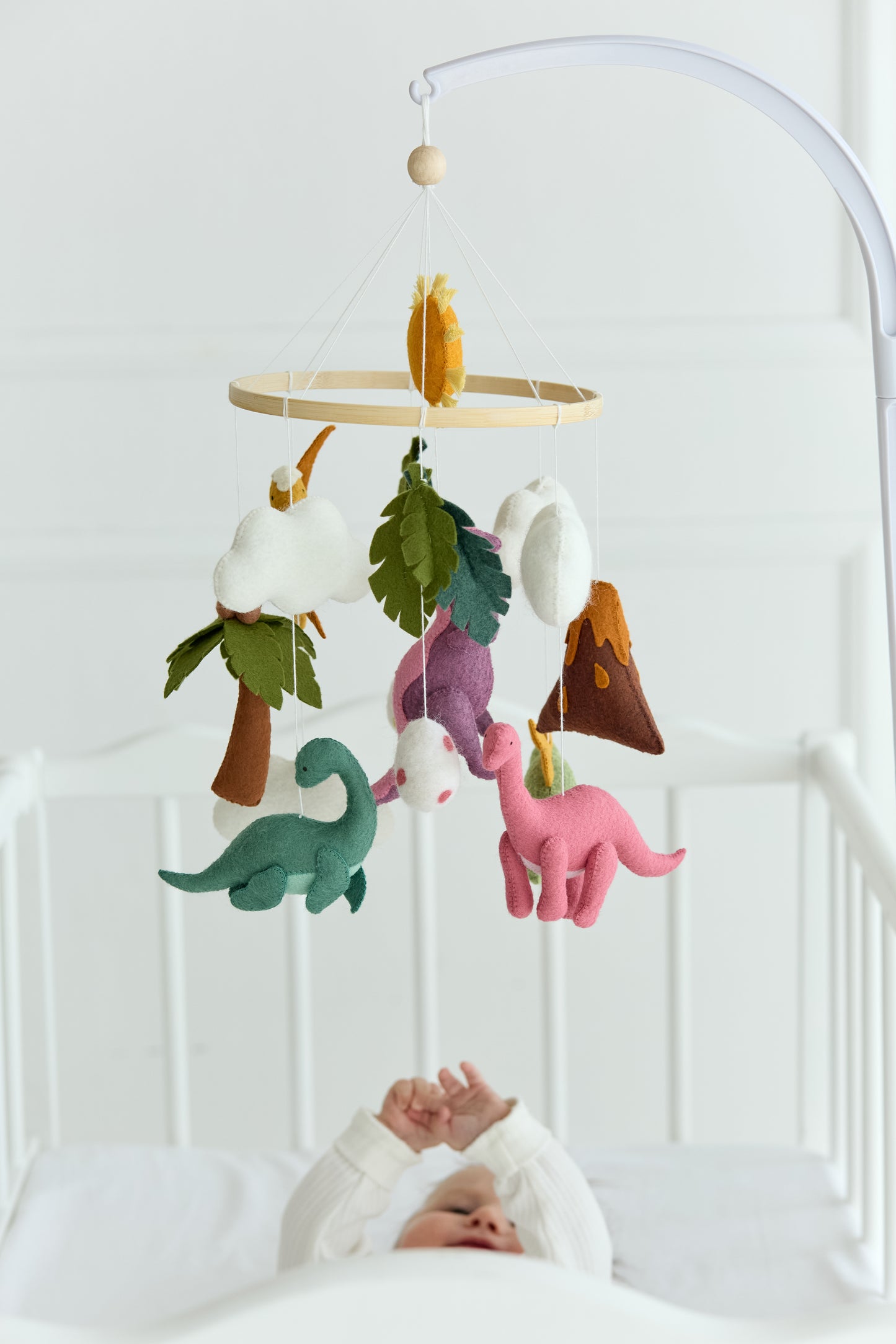 Dinosaur baby mobile with volcano and sun
