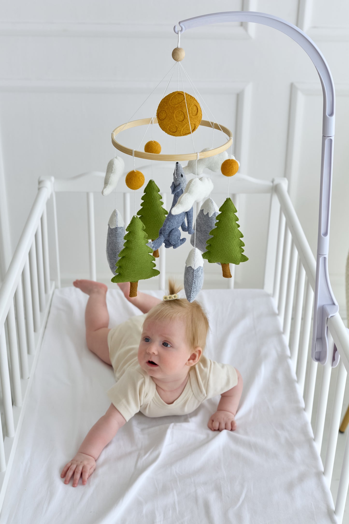 Neutral woodland mobile with clouds, moon and wolf