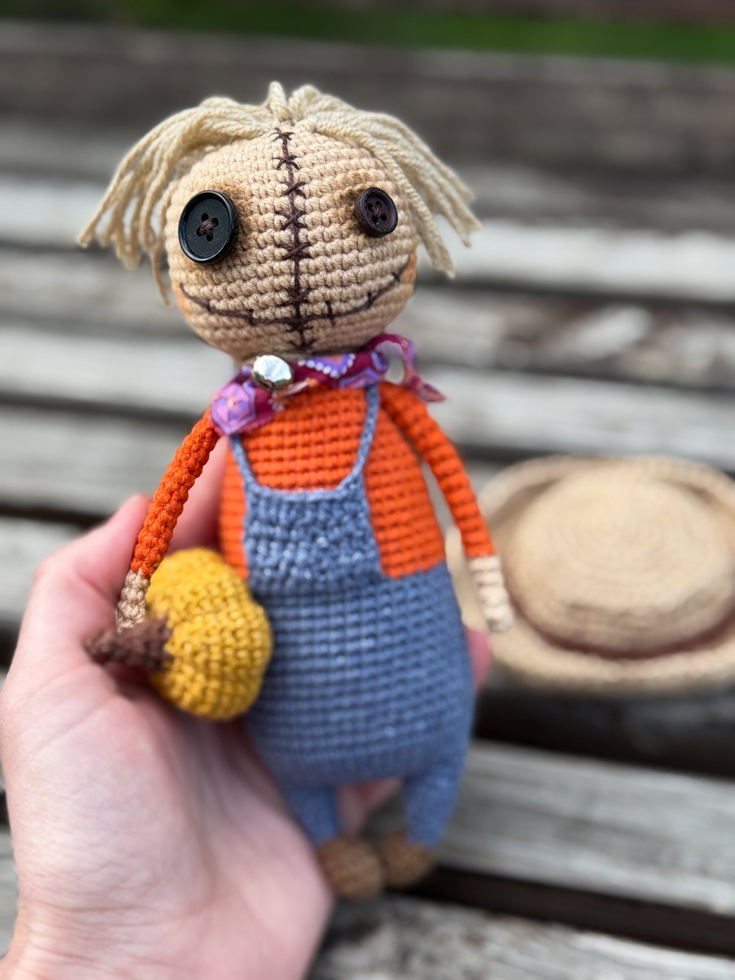 Amigurumi scarecrow doll holding pumpkin – farmhouse autumn and Thanksgiving crochet toy