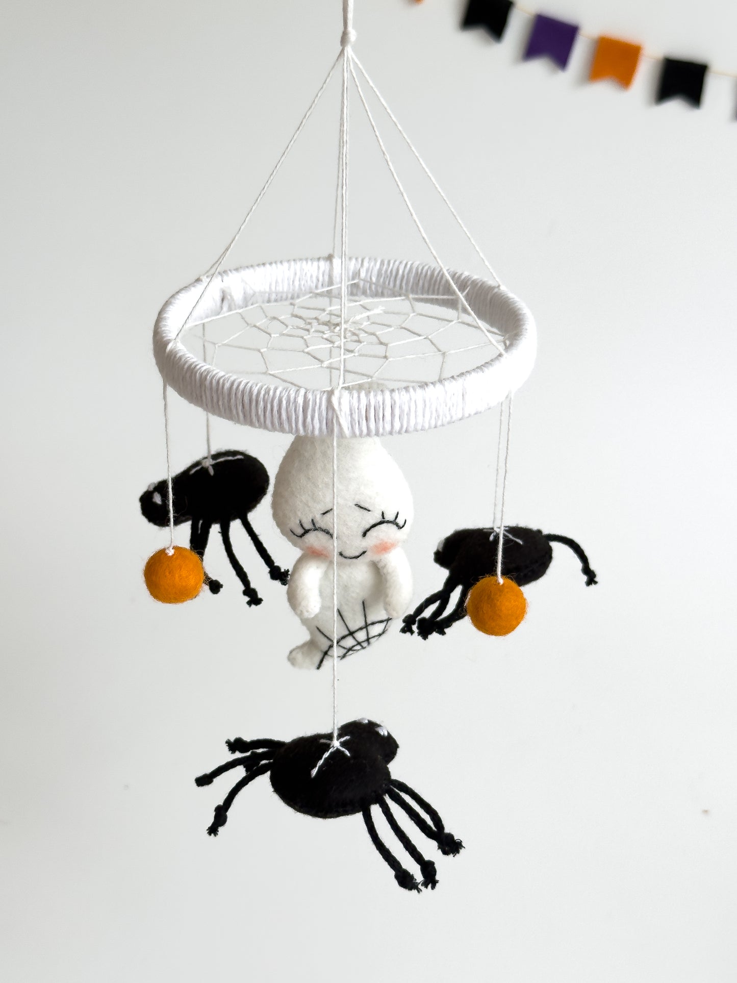 Felt ghost baby mobile with orange felt balls
