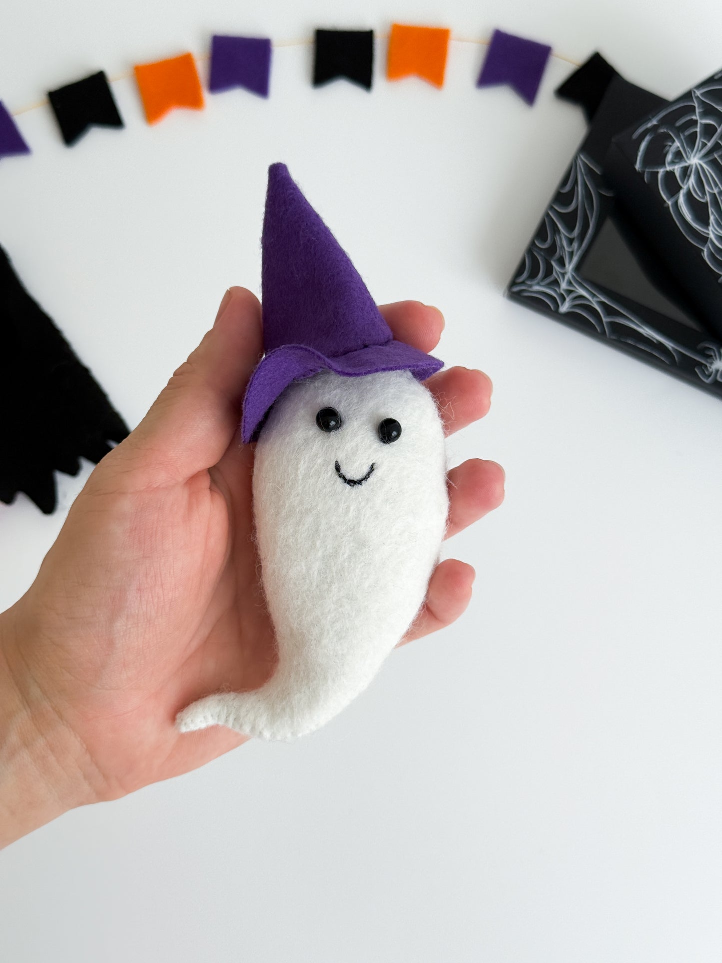 Handmade felt ghost toy wearing a purple witch hat and black dress – Montessori Halloween pretend play set