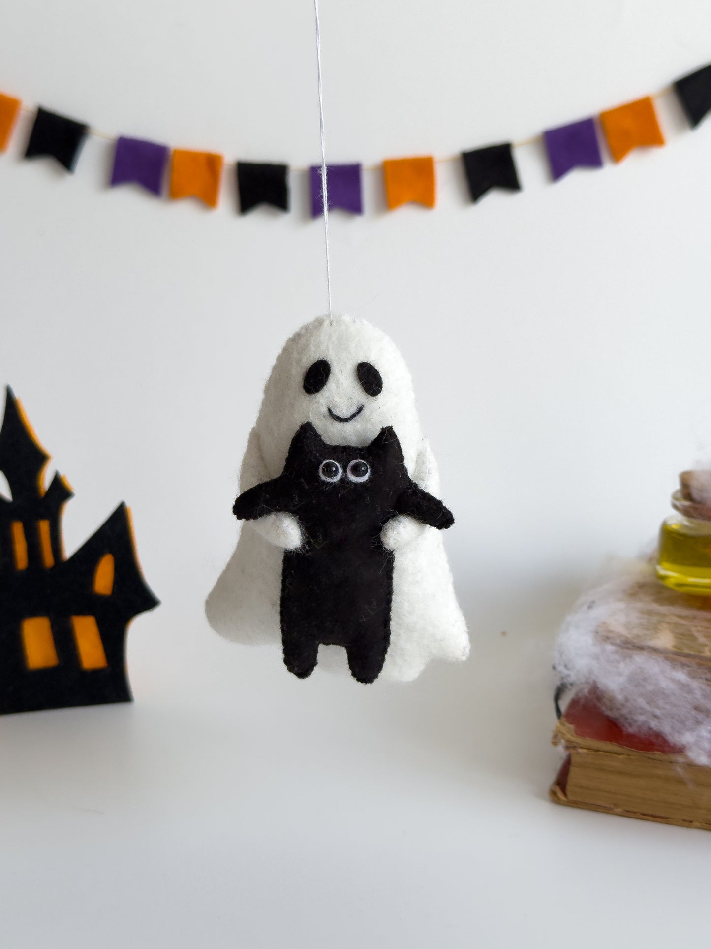 Handmade ghost plush holding black cat for Halloween decor