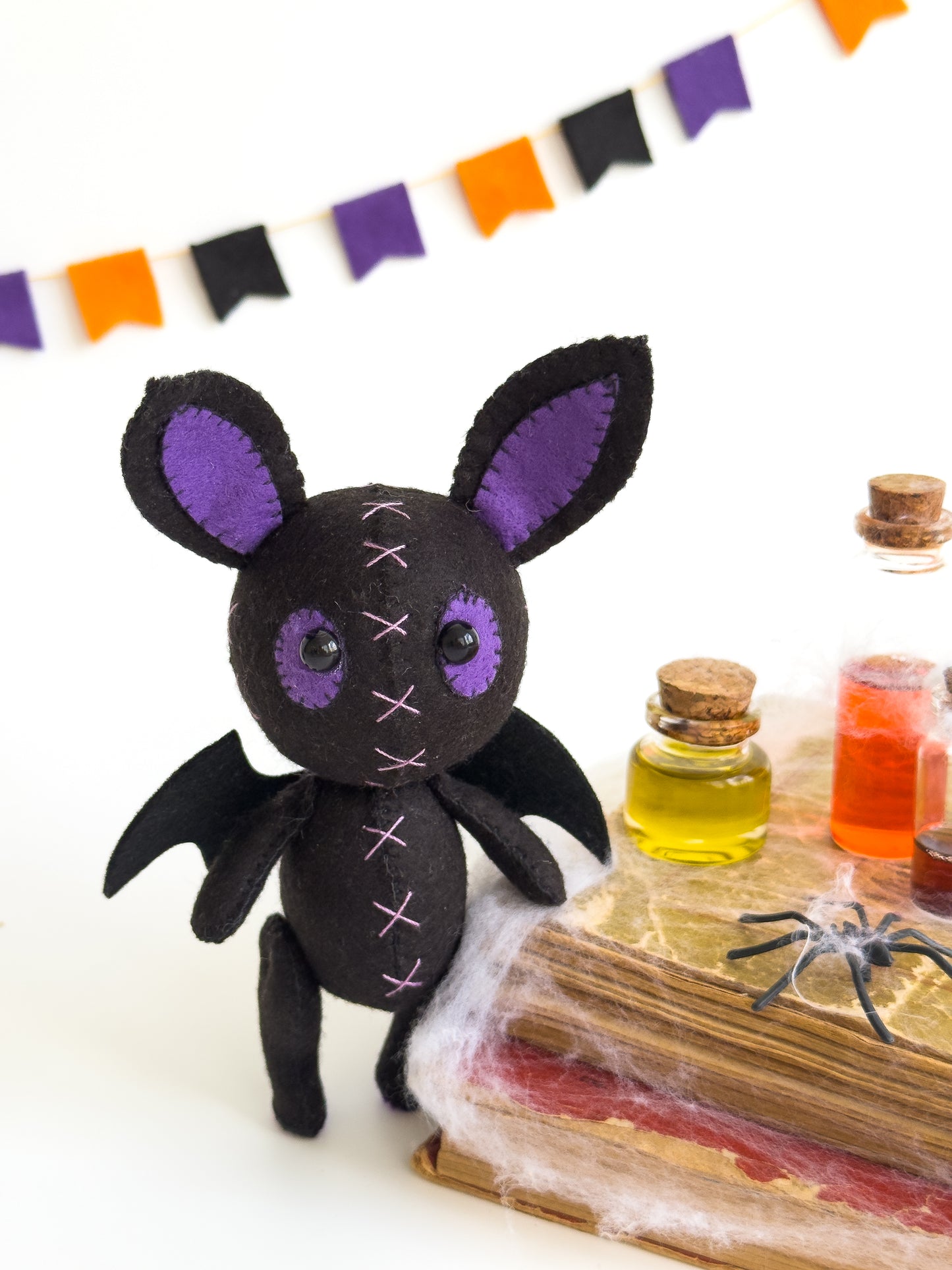 Black bat stuffed toy for spooky Halloween decor
