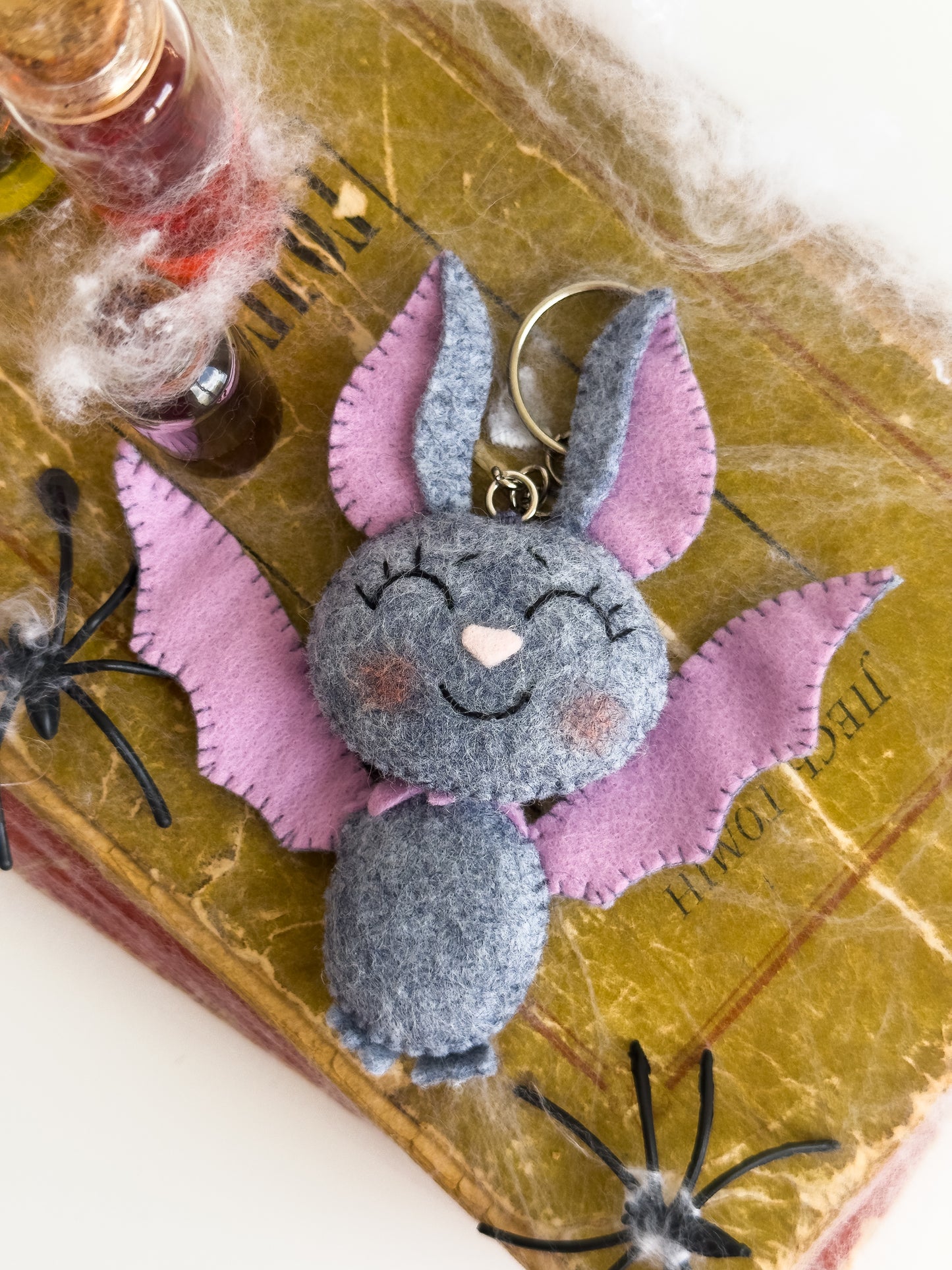 Lightweight Halloween bat keychain accessory for kids and adults, smiling plush charm