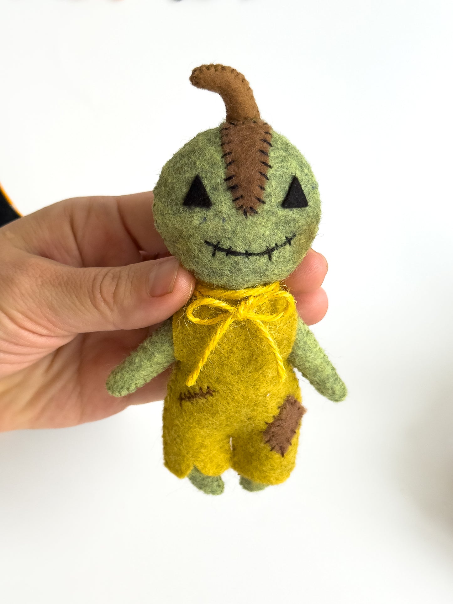 Pumpkin boy plush in orange costume – handmade fall toy