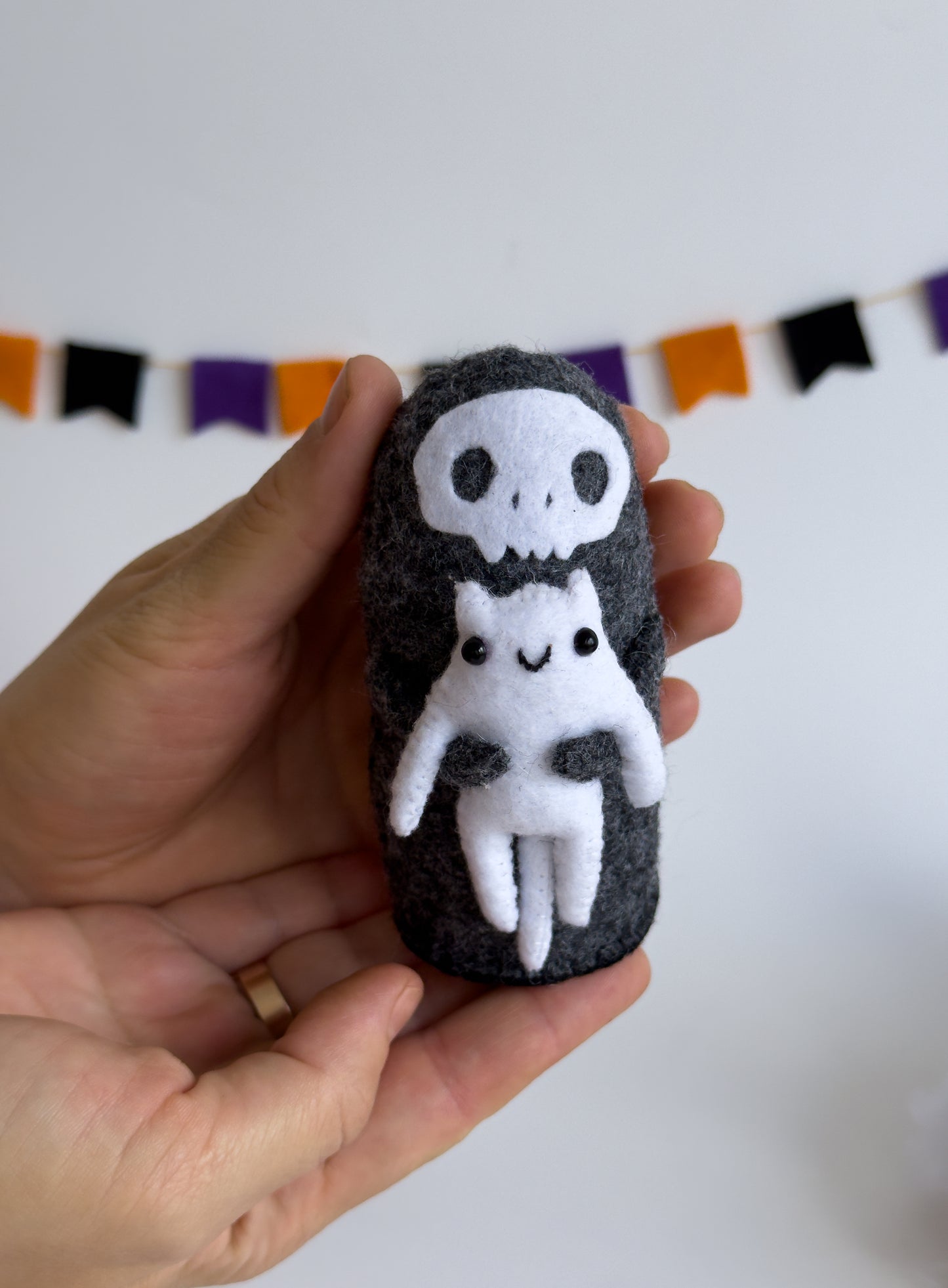 Grim Reaper felt plush holding a white cat – handmade Halloween shelf decor