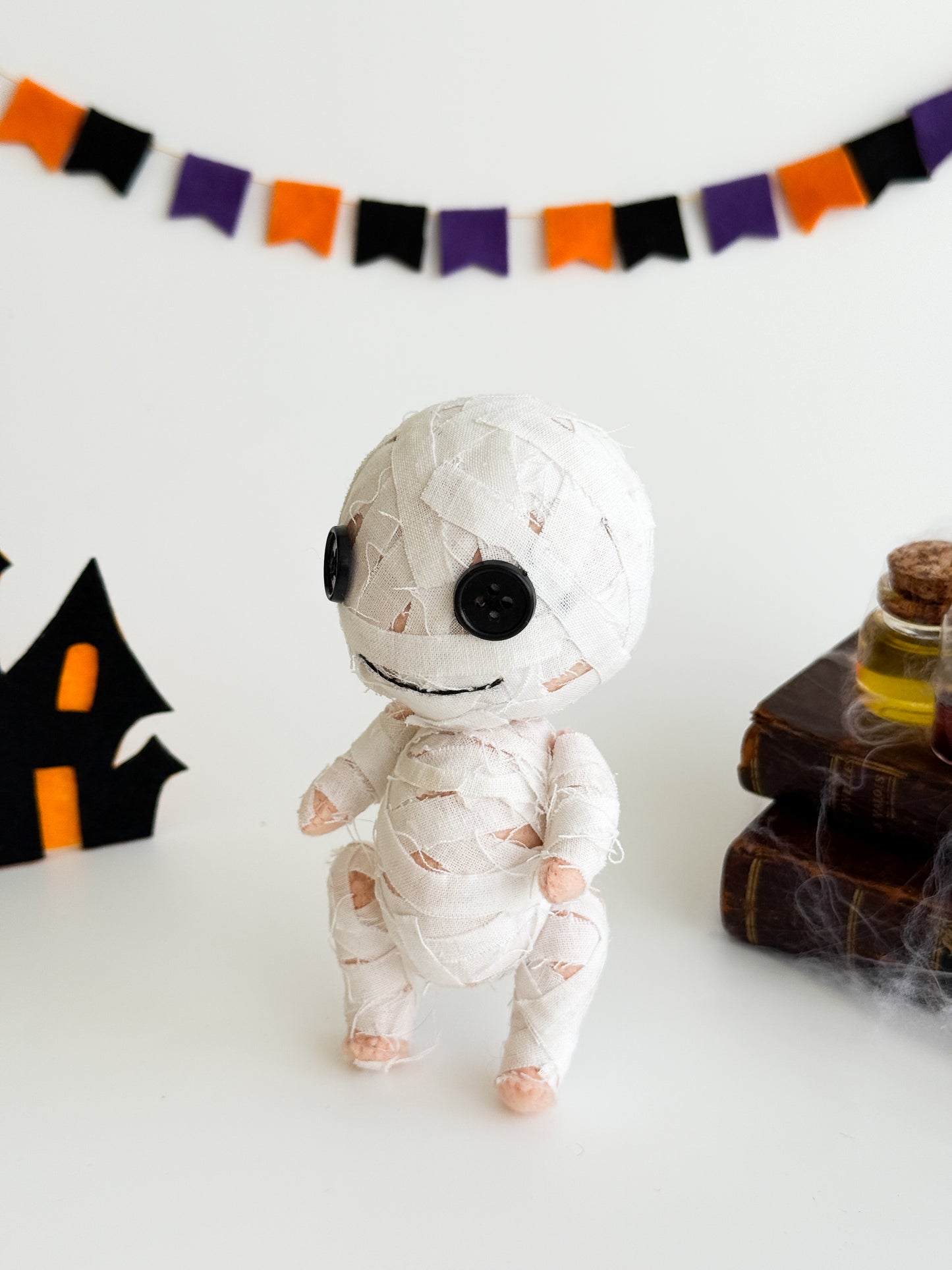 Kawaii spooky mummy decoration for Halloween shelf