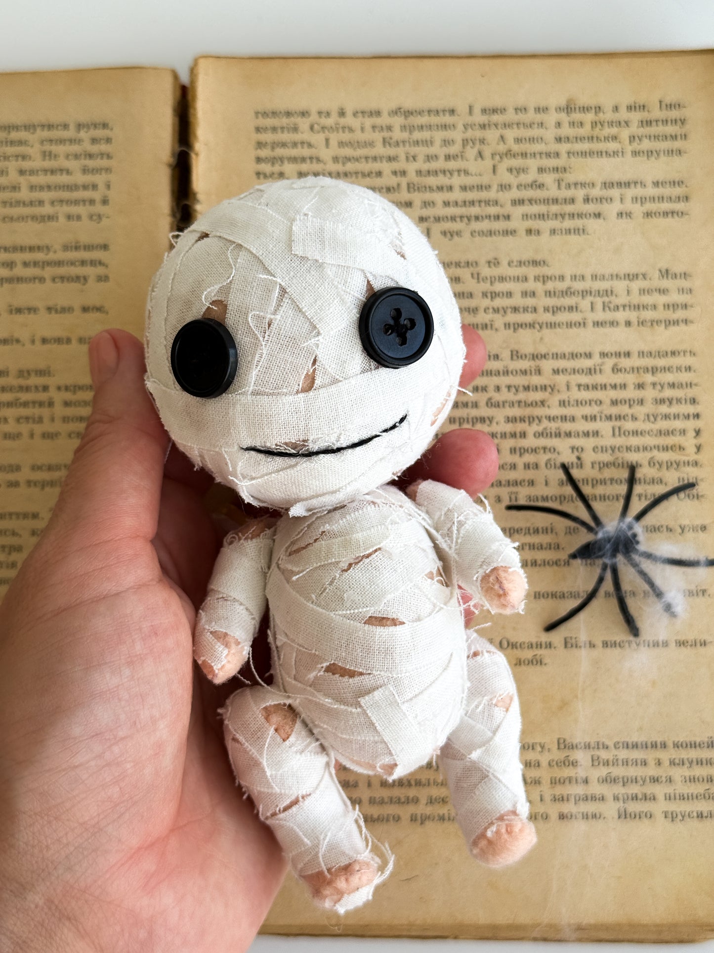 Handmade felt mummy plush with stitched cotton bandages and button eyes