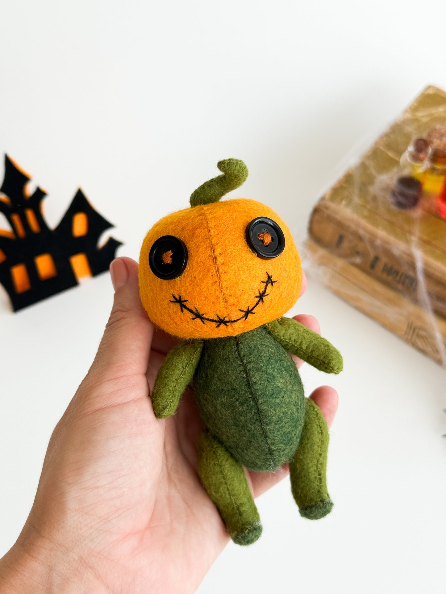 Handmade spooky cute pumpkin plush with button eyes