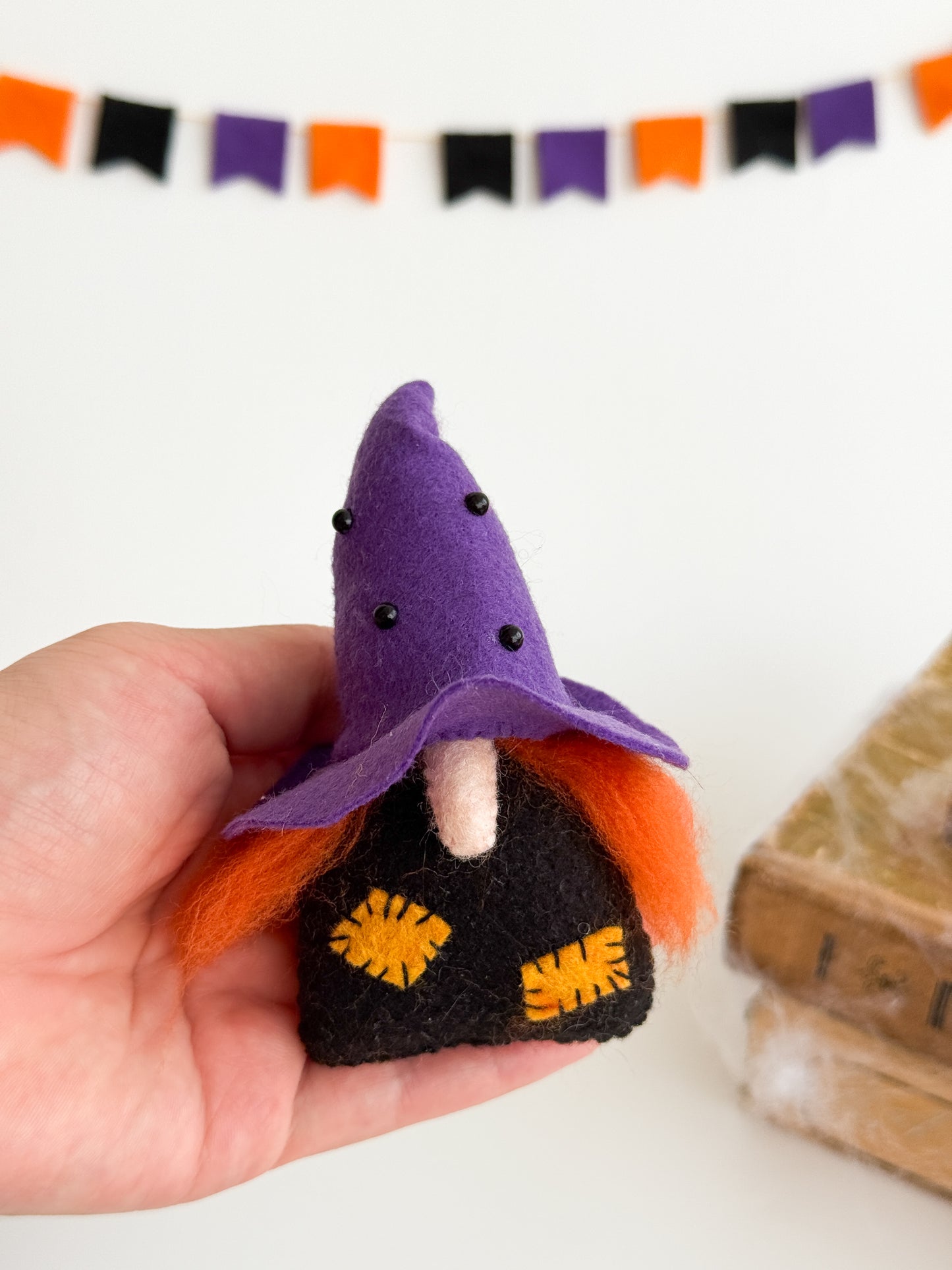 Purple felt Halloween gnome with orange hair and wool beard