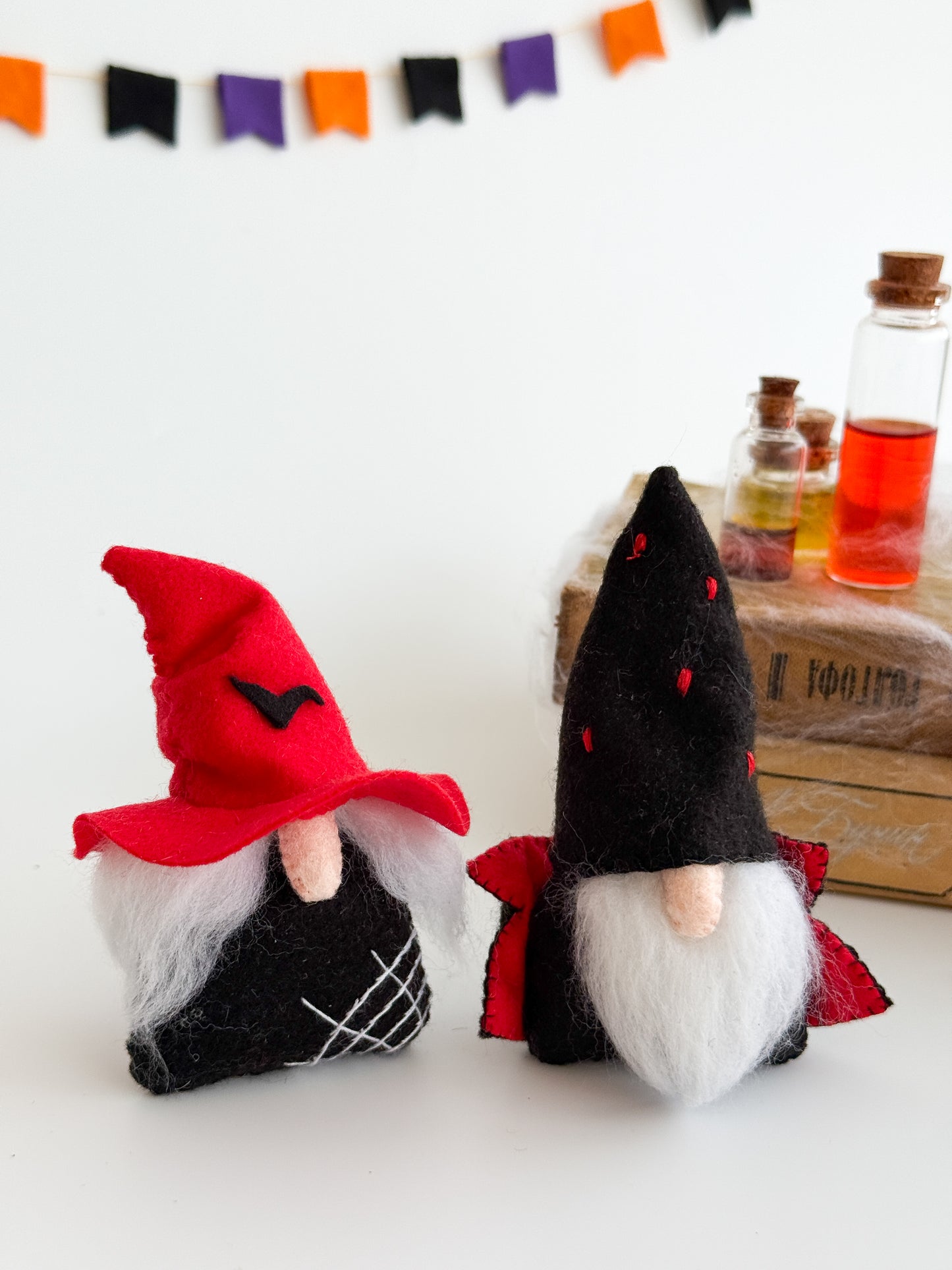 Handmade felt Halloween gnomes with colorful hats and natural wool beards