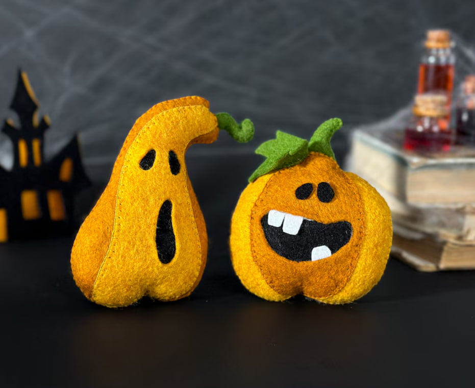 Halloween pumpkin plush toys on festive dark background