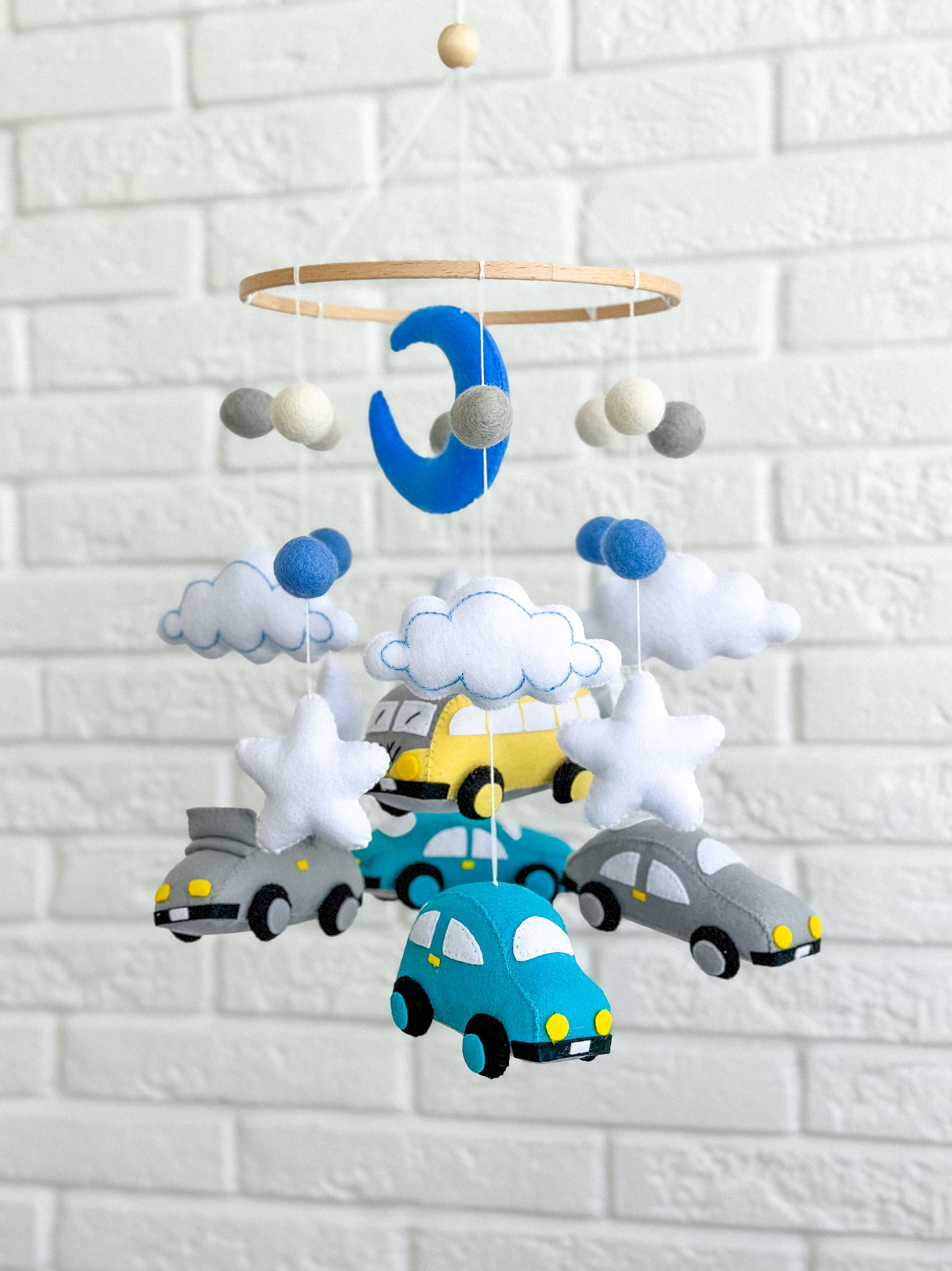Full mobile above crib – musical baby mobile with moon and cars option