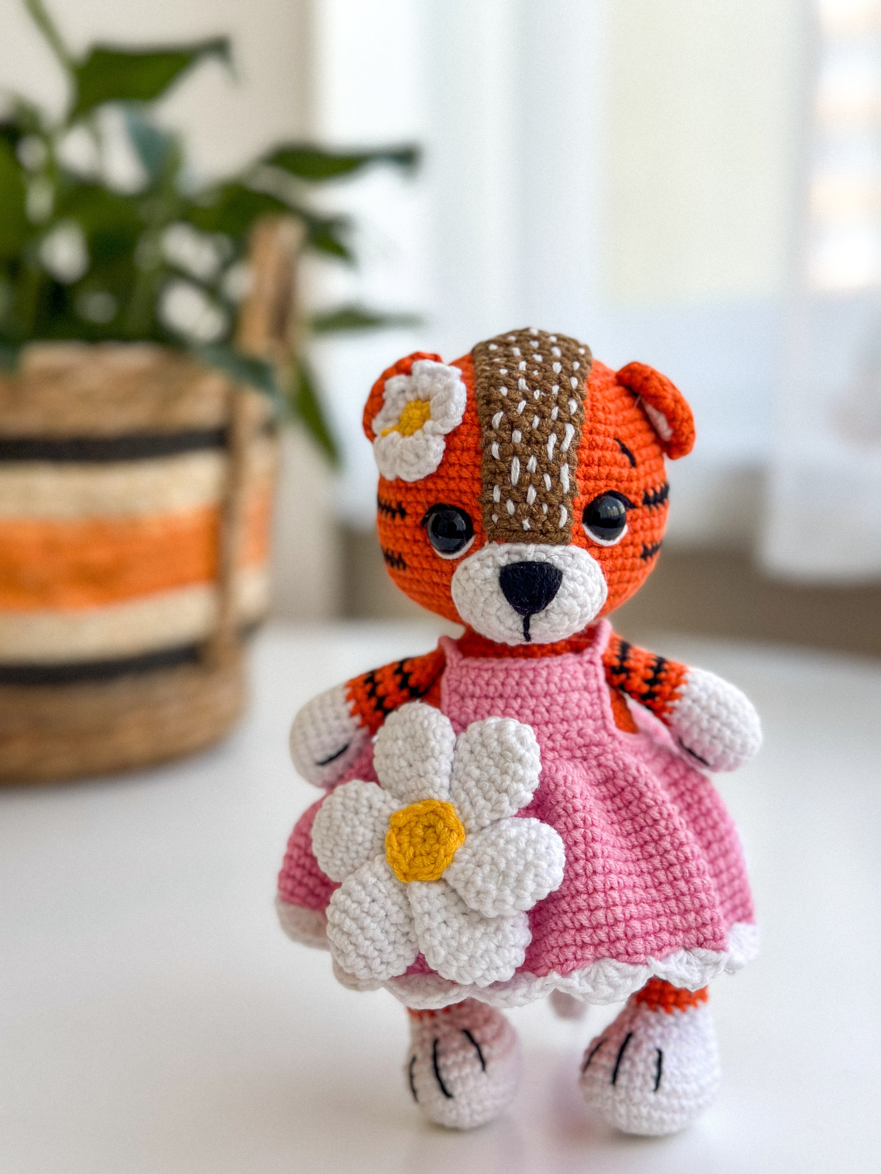 Handmade crochet tiger girl in a pink dress – soft amigurumi baby toy with hypoallergenic filling