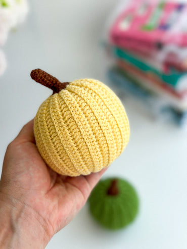 Hand-knitted pumpkin in yellow – soft fall or Halloween decor