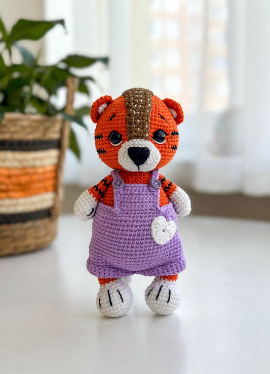 Handmade crochet tiger boy in overalls – soft amigurumi baby toy with hypoallergenic filling