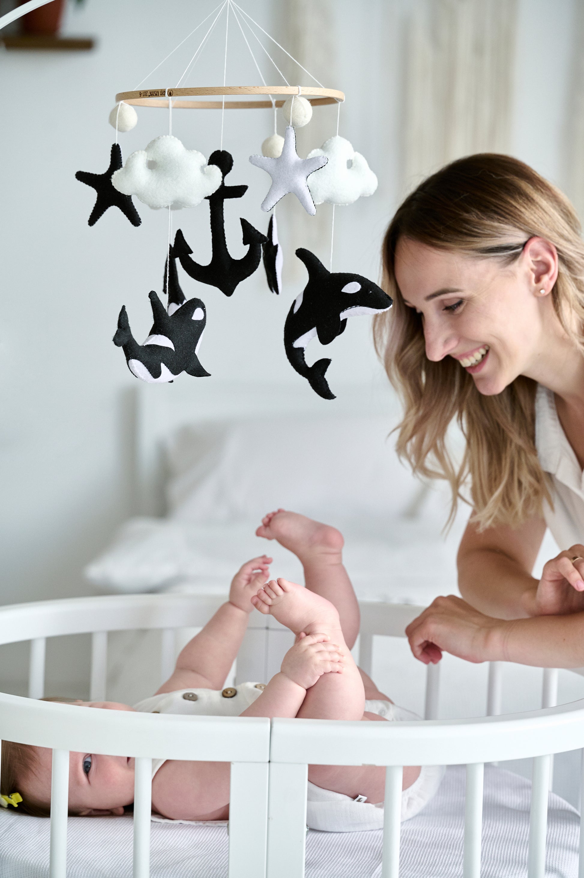 Minimalist baby mobile with orcas, clouds and anchor – black and white nursery