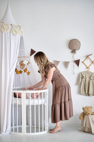 Handmade felt baby mobile with neutral tones for nursery