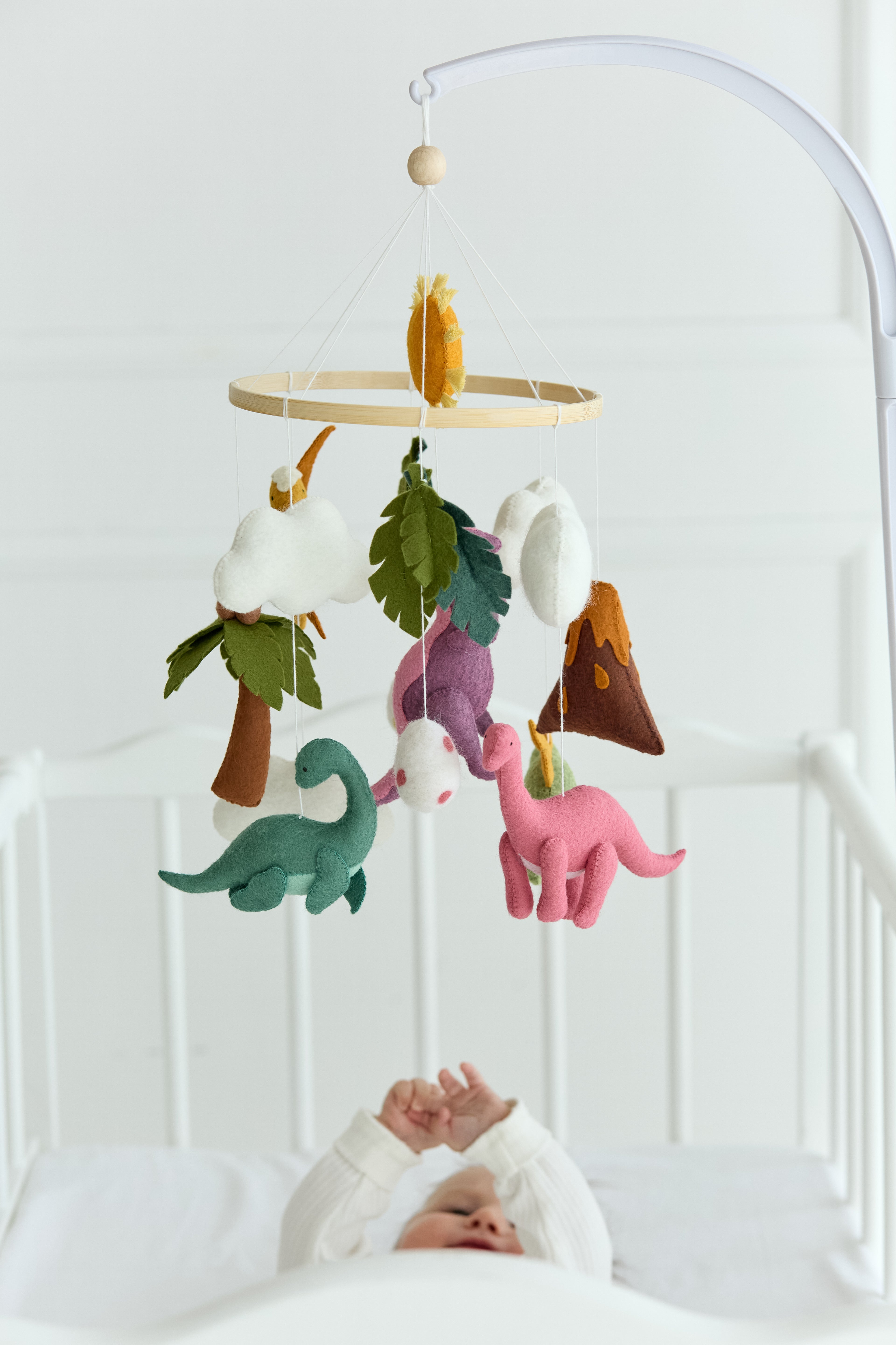 Dinosaur baby mobile with volcano and sun