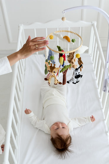 Jungle nursery decor mobile with elephant, lion, and zebra