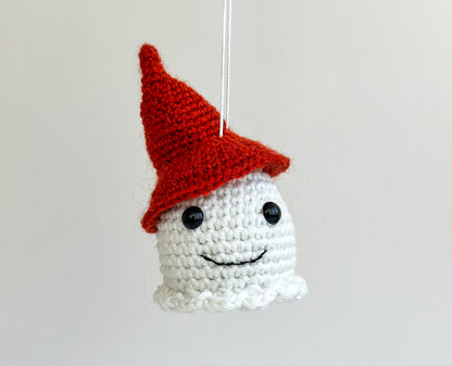 Cute amigurumi ghost car charm glowing at night