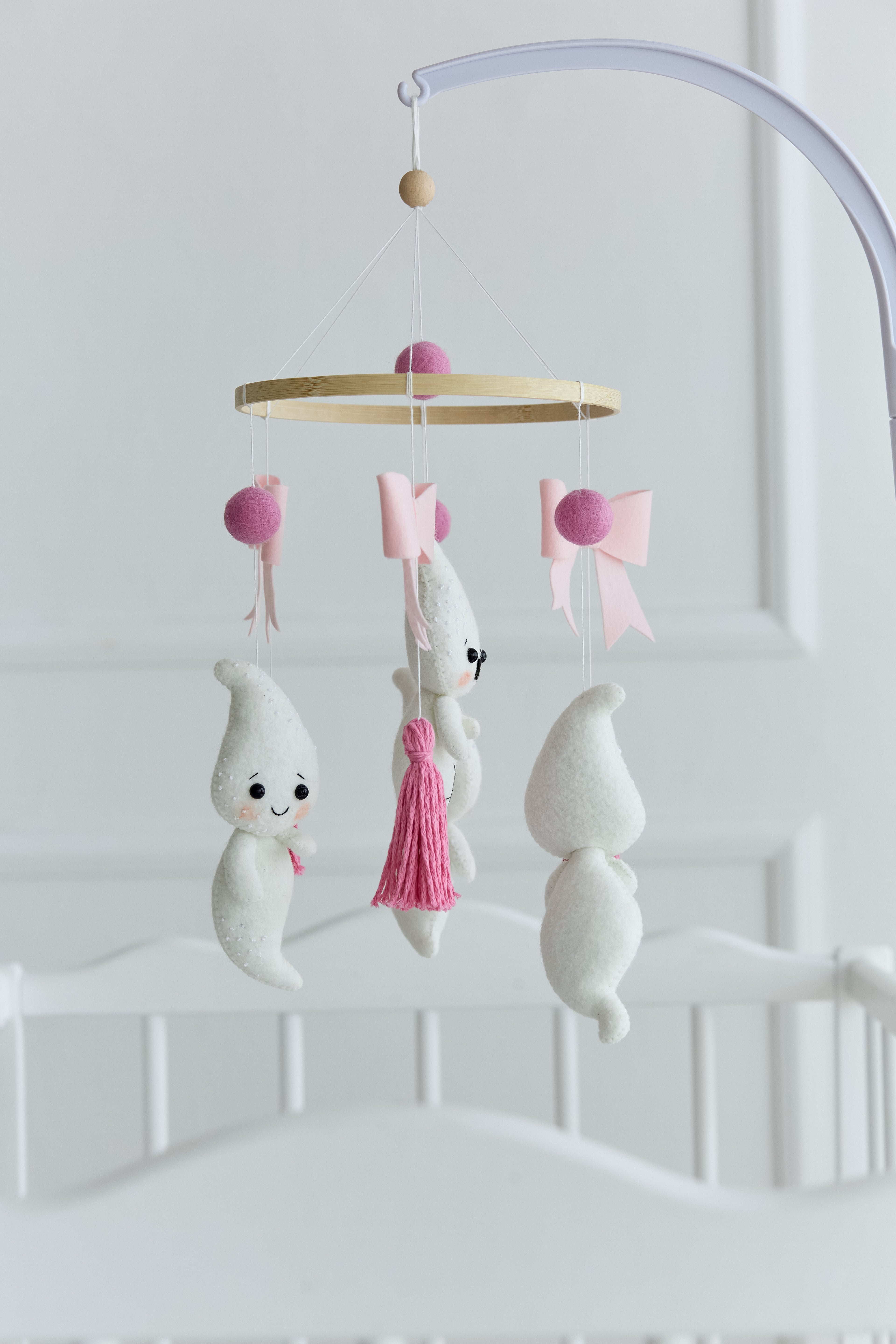 Handmade ghost baby mobile with pink bows and tassels