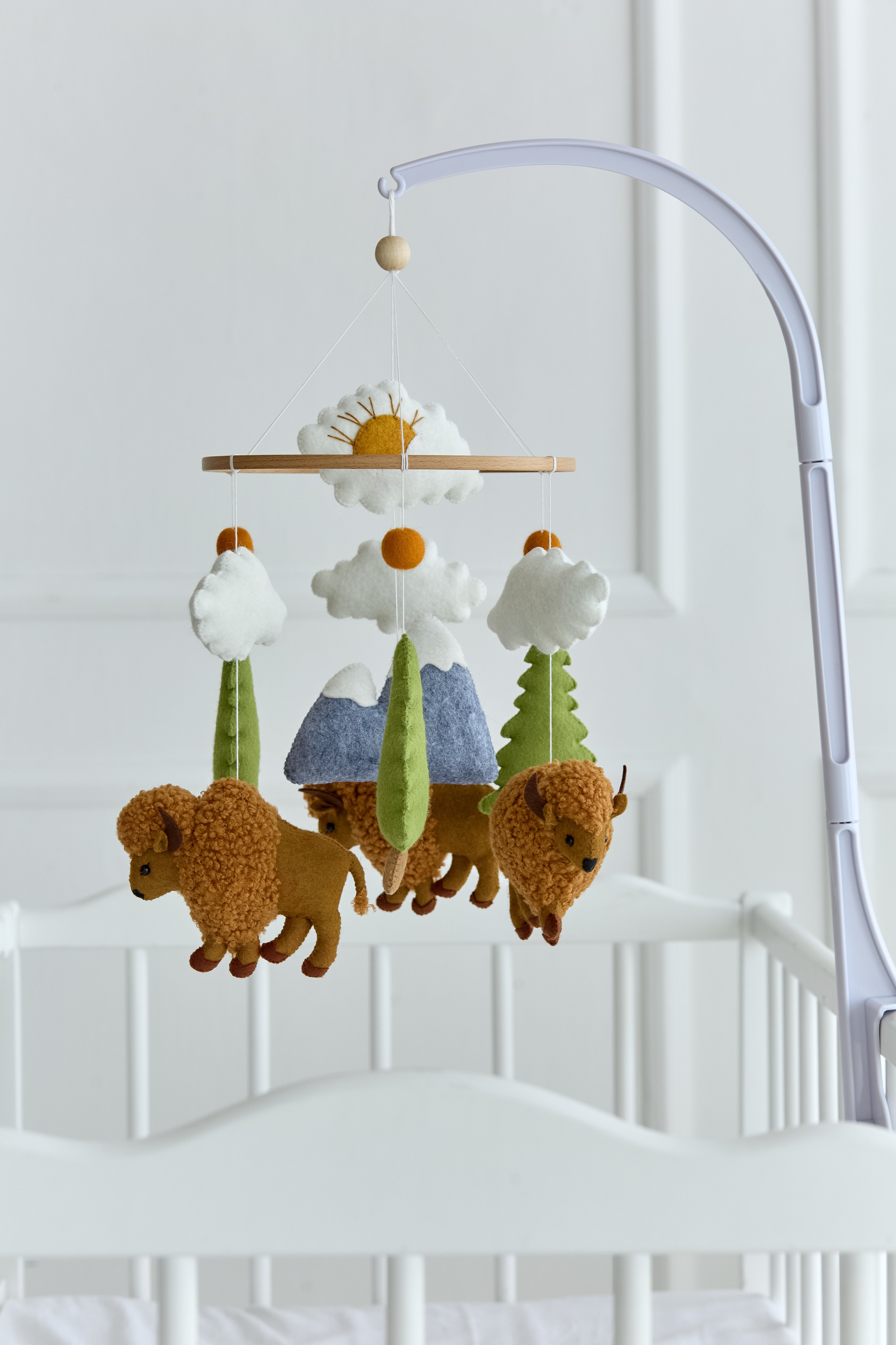 Handmade buffalo baby mobile with boucle bison and felt trees