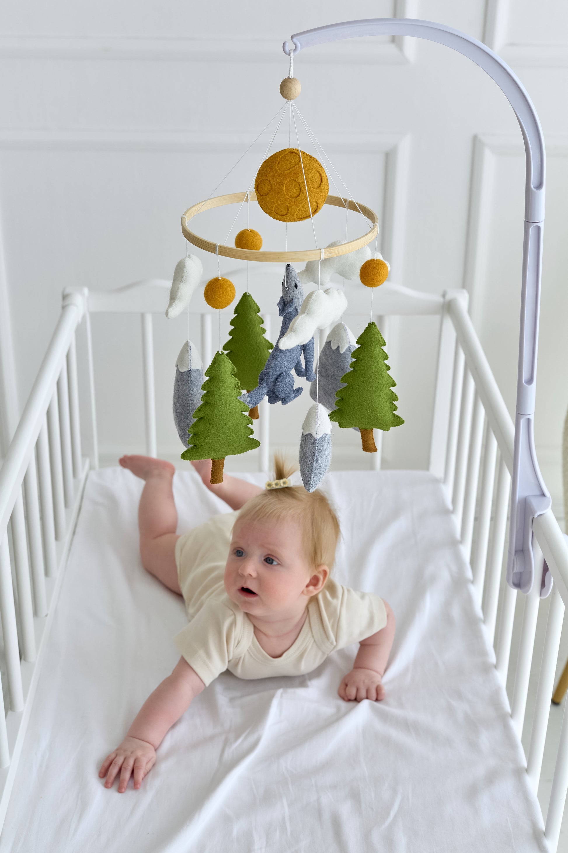 Neutral woodland mobile with clouds, moon and wolf