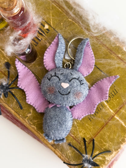 Lightweight Halloween bat keychain accessory for kids and adults, smiling plush charm