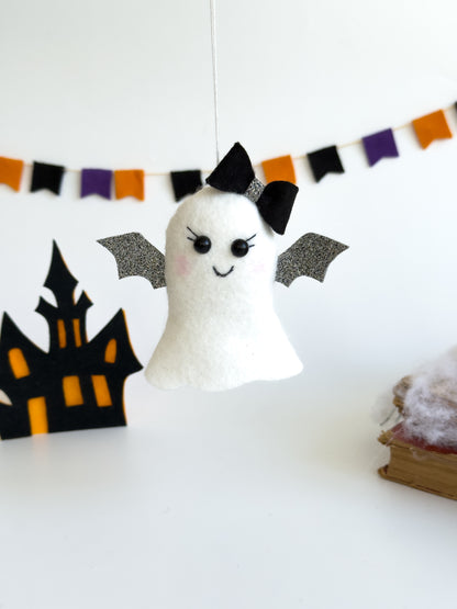 Felt ghost ornament with bat wings and black bow, 4 inches tall