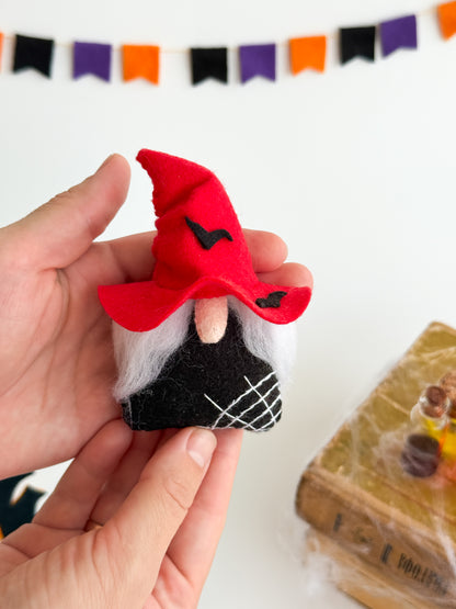 Red felt Halloween gnome with white beard and stitched details