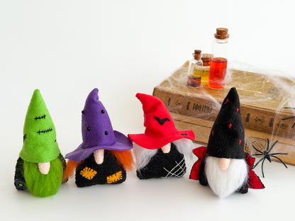 Handmade felt Halloween gnomes with colorful hats and natural wool beards
