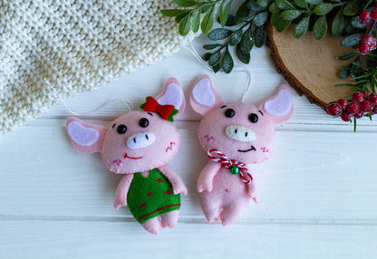 a couple of piglets on a Christmas tree